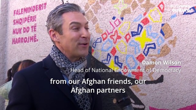 Afghan artists who fled Taliban paint mural to say 'Thank you, Albania!'