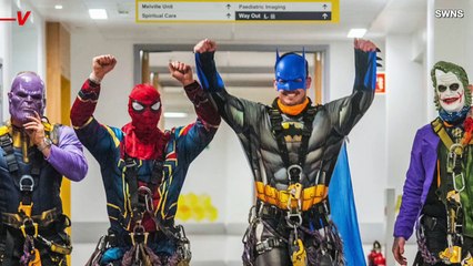 Superheroes Rappel Down the Side of Children’s Hospital Bringing Holiday Cheer to Those in Need