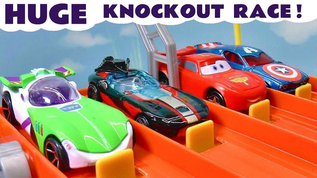 Lightning McQueen Toy Cars from Pixar Cars 3 Racing with The Funlings Cars versus Hot Wheels Cars Giant Knockout in this Family Friendly Full Episode English Video for Kids