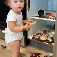 Small Cute Baby Eating Chocolate, Its Yummy Mom