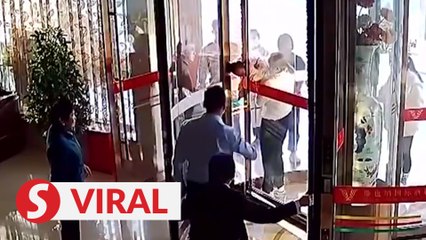 Baby stuck in hotel’s revolving doors rescued in just three minutes