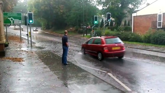 Crazy Man getting soaked by giant puddle