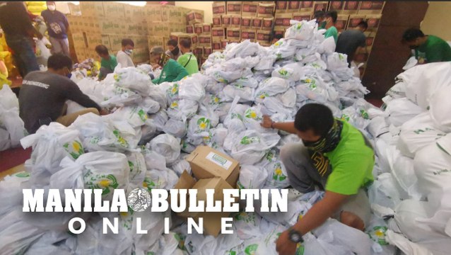 PAGCOR workers pack relief goods for the victims of Typhoon Odette in Imus, Cavite