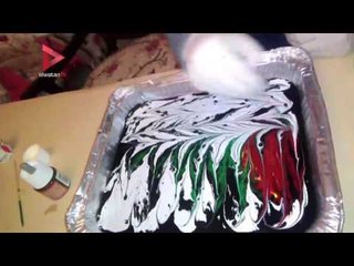 مي عتمان.. فتاة تخرج عن المألوف بـ "الرسم على الماء"