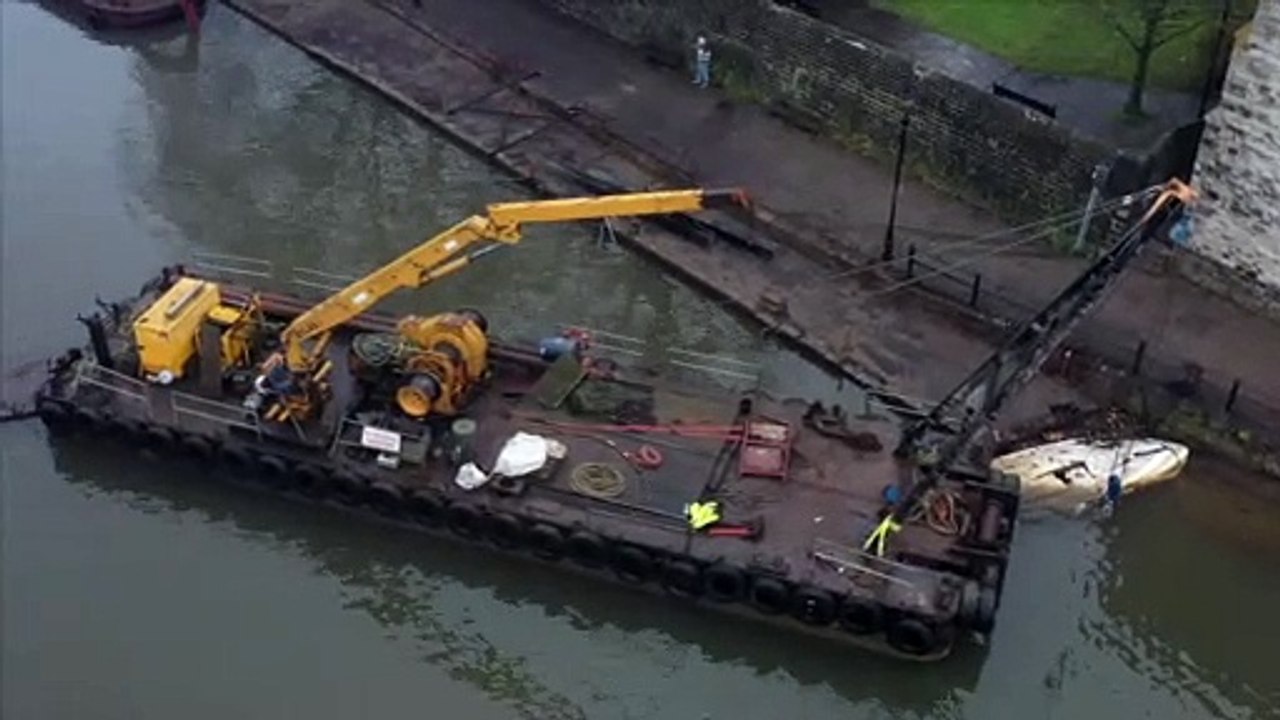 The burnt out Embankments restaurant is towed away