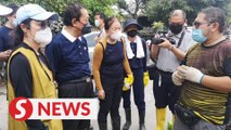 Floods: Michelle Yeoh, Vincent Tan join clean-up efforts in Taman Sri Muda