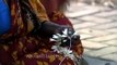 South Indian woman making Gajra (flower garland)