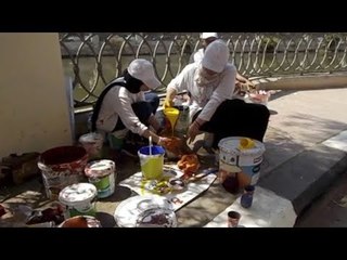 طلاب ومعيدون وأساتذة يجمّلون أسوار كورنيش بحر يوسف في الفيوم