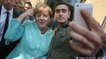 The selfie with Merkel that changed a refugee's life