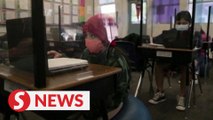 US schools struggle to reopen amid Omicron wave