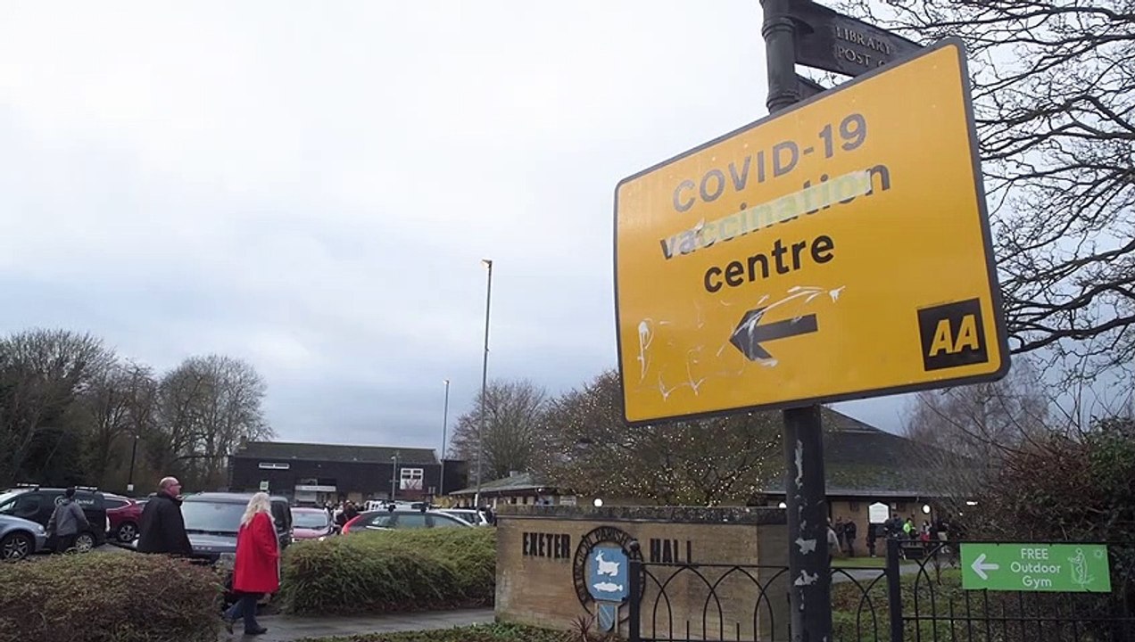 Footage shows queues outside a vaccination centre as bookings for booster open to over 30s