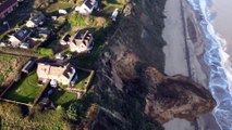 Seaside homes left dangling on cliff edge after huge landslide in Norfolk, UK