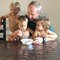 Grandpa Feeds Toddlers From His Cereal Bowl While Eating Breakfast