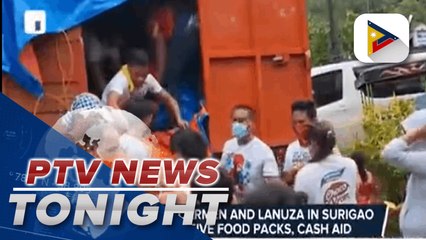 Residents of Carmen and Lanuza in Surigao Del Sur receive food packs, cash aid