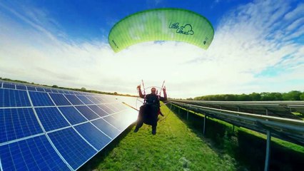 Paramotor Cruising Low Over Solar Farm