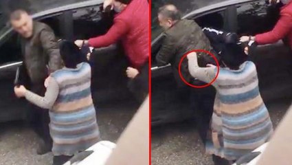 Oğlunu teslim etmek istemeyen anne, polisin belindeki silahı böyle aldı