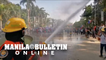 Firefighters disperse protesters at Liwasang Bonifacio in Manila