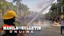Firefighters disperse protesters at Liwasang Bonifacio in Manila