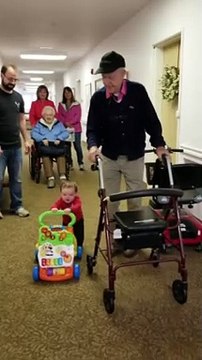 Baby and Great Grandfather Using Walkers Side by Side