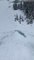 Skiers Skim Across Frozen Pond