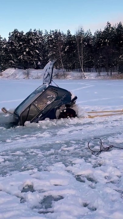 Car Collapses During Frozen Lake Recovery