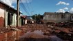 Brazil firefighters inspect buildings damaged by flooding