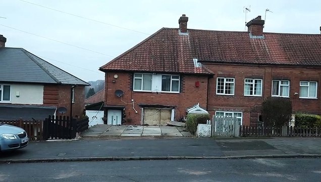 Homeowners shocked after their parked car ploughed through their living room wall in freak hit-and-run crash