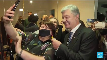 Facing arrest, ex-leader returns to 'defend Ukraine' from Russia