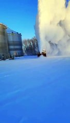 Old SnoGo Truck Launching Snow High into the Air