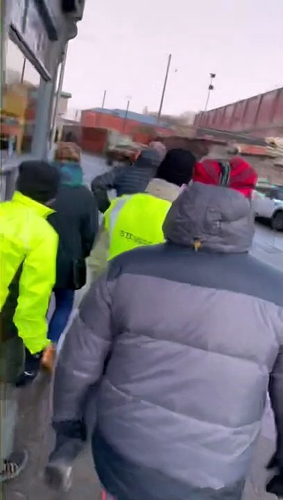 Friends and colleagues  of prison dog handler Paul Bailey  are greeted by 200 wellwishers after completing a 74 mile walk from Bridlington to Wakefield Prison
