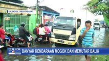 Kali Semongol Meluap, Jalan Kamal Raya dari Arah Cengkareng Masih Tergenang Banjir