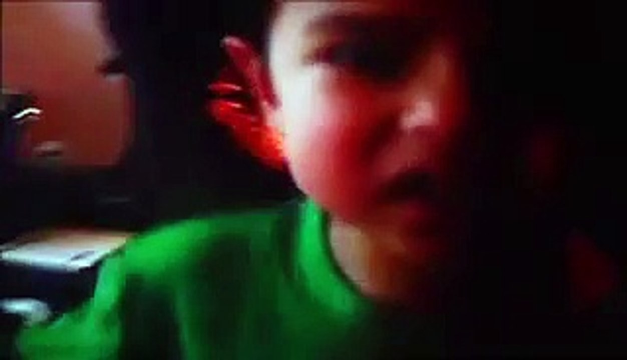 Jonathan  playing  the  wii  while  Christopher  & Anthony  watch