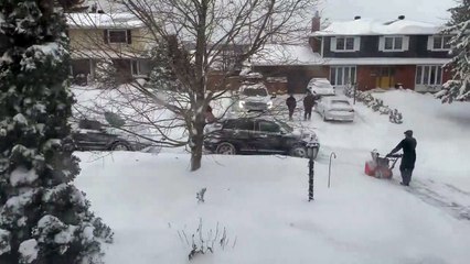 Daredevil performs a snowmobile drive-by in a residential street in Ottawa during blizzard