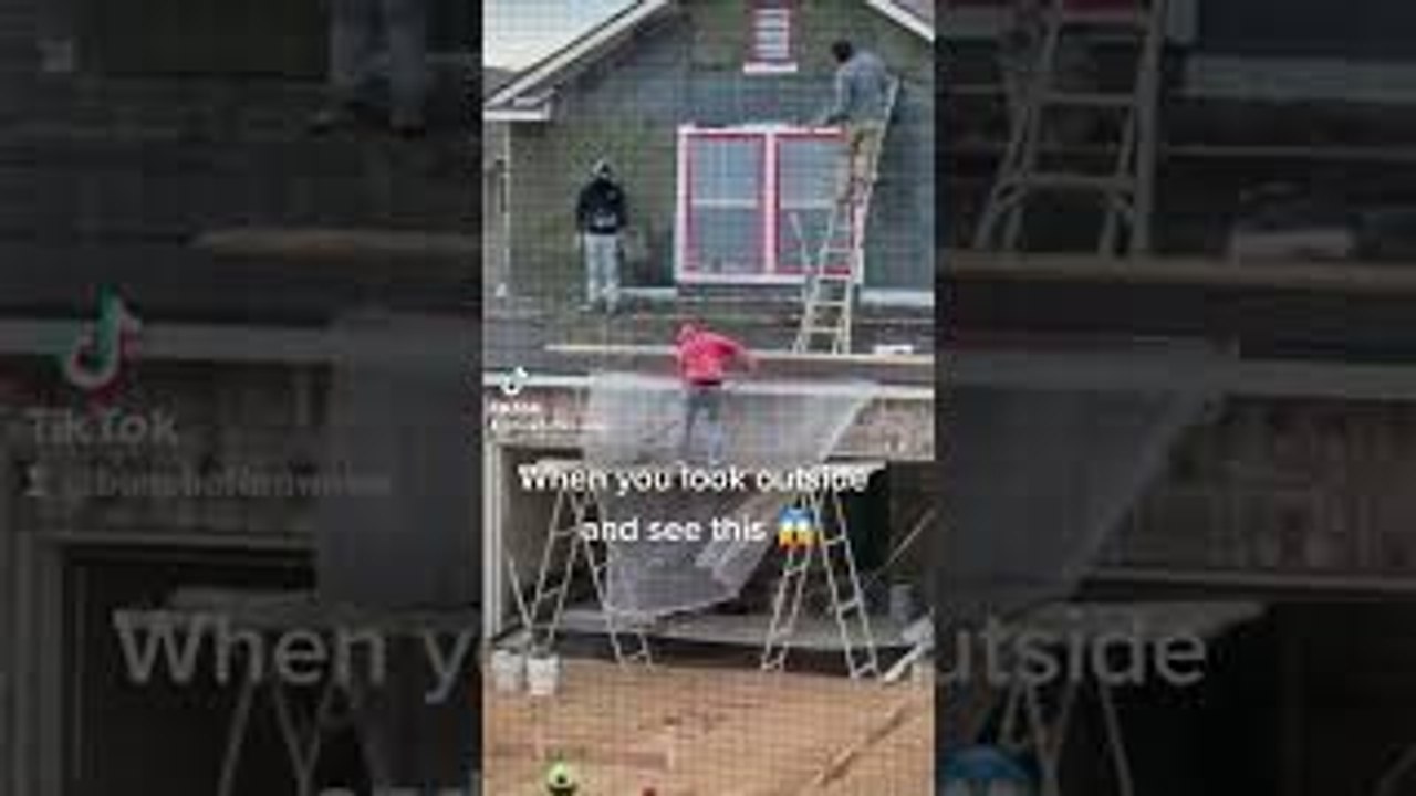 Construction Workers Tossing and Catching Mortar