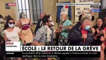 Des manifestants en maillot de bain dansent et chantent devant le Ministère de l'Education pour parodier les vacances de Jean-Michel Blanquer à Ibiza