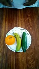banana orange and cucumber art.