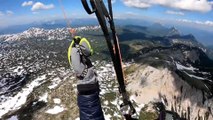 Paraglider Flies Over Snow Covered Mountains in Austria