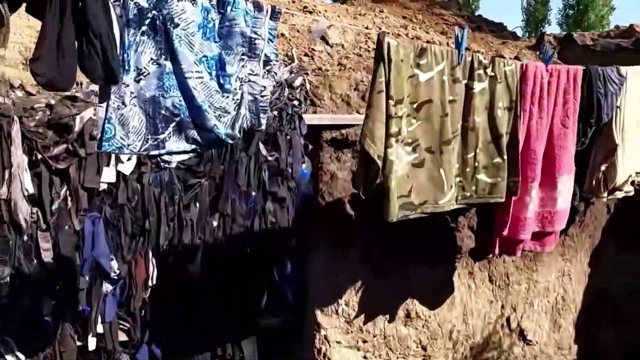 Ucraina, la vita di chi combatte in trincea, tra caffè, disegni dei bambini e bucato da stendere