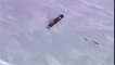 Guy Tumbles While Snowboarding Downhill on Snowy Mountain