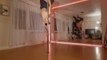 Dance Instructor Performs Cool Balancing Tricks While Pole Dancing