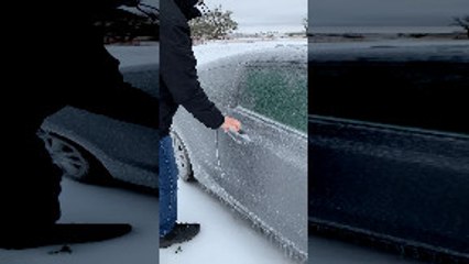 Opening the Door on an Ice-Covered Car