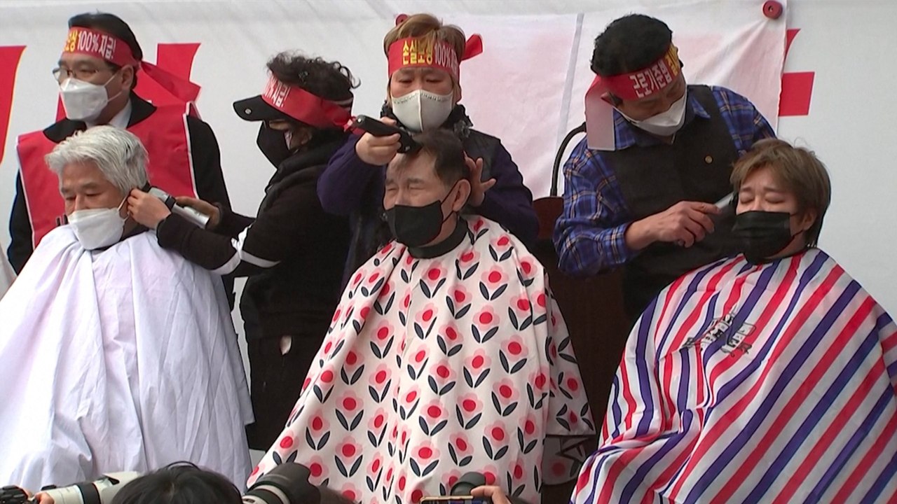 South Korea’s small business owners shave their heads in protest against curfew to contain Covid-19