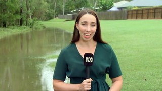 Two people rescued after driving into Queensland floodwaters