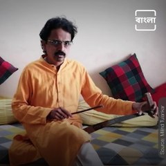 Man Playing National Anthem On Saw