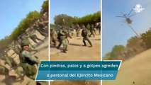 Pobladores agreden con piedras y palos a elementos del Ejército en Aguililla, Michoacán