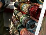 Colorful Indian bangles displayed in racks, Dillii Haat