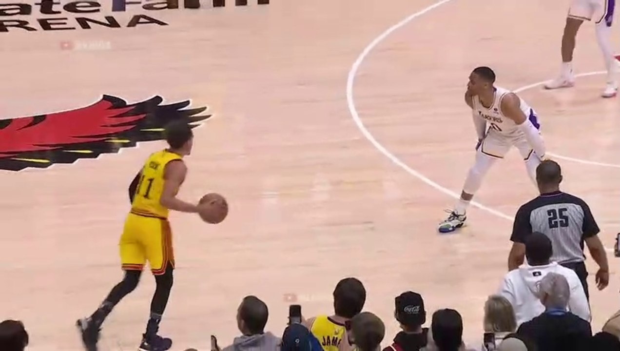 Trae Young hits a dagger while Westbrook looking at the shot clock 