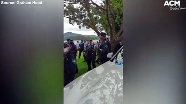 Police appear to 'cheers' with pepper spray cans at March Against Mandatory Vaccination | February 3, 2022 | Canberra Times