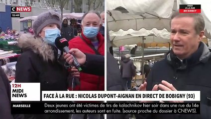 Face à la rue - Nicolas Dupont-Aignan interpellé sur le marché de Bobigny par une habitante: "La seule chose que vous voulez c'est la place" - VIDEO