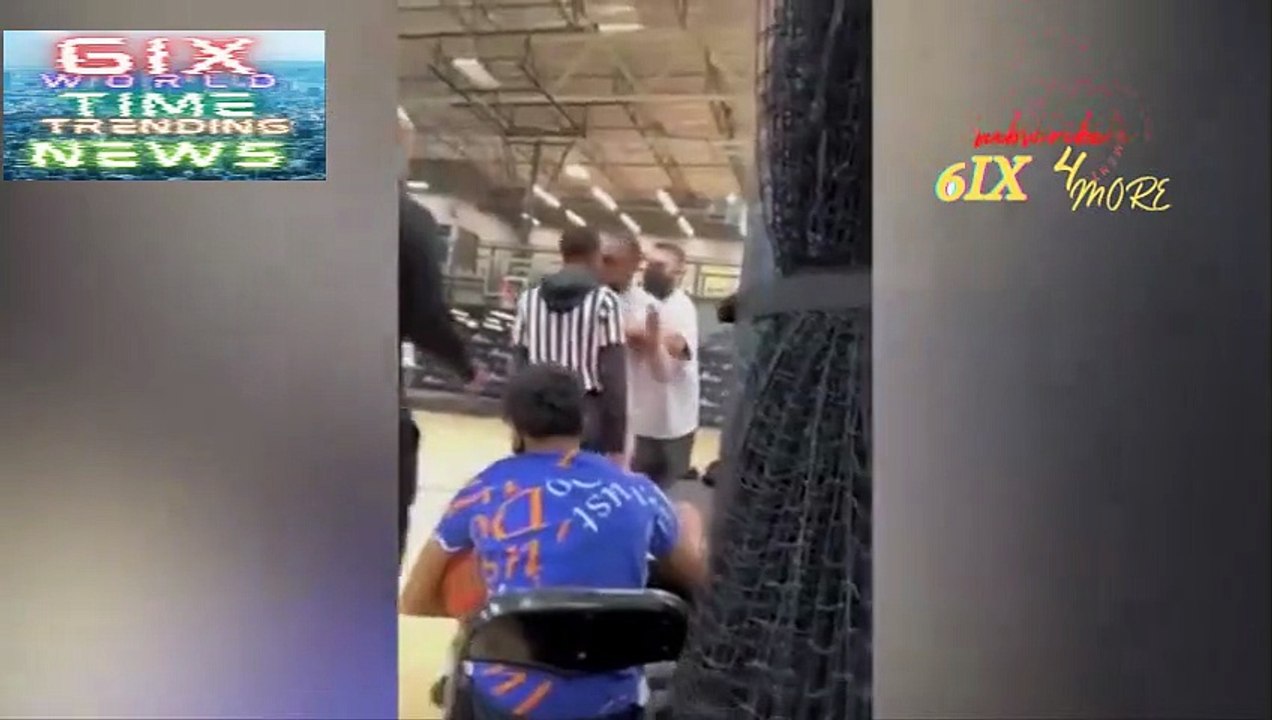 Basketball coach grabs referee